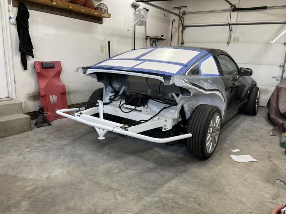 Mustang with a painted tube rear end and bash bar