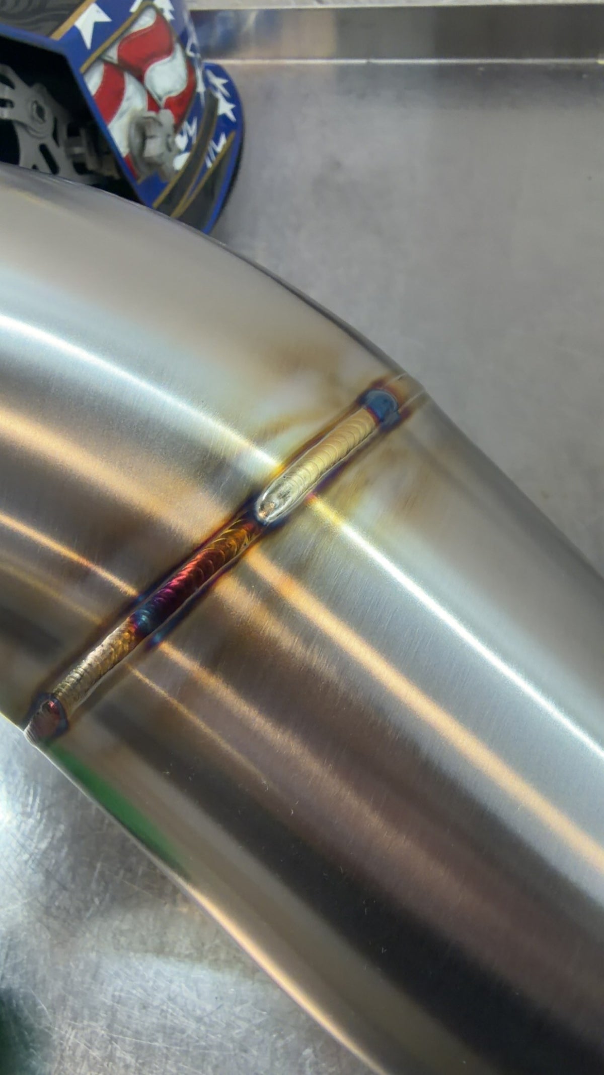 Close-up of a TIG weld bead on stainless tubing